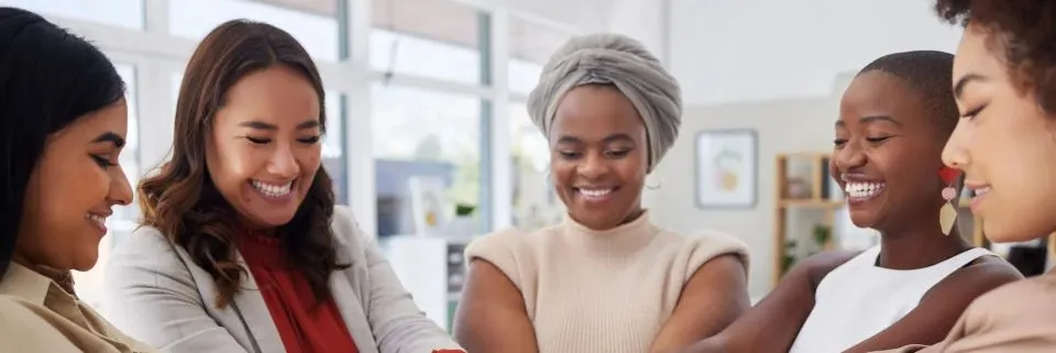 Women sharing conversation in a welcoming circle